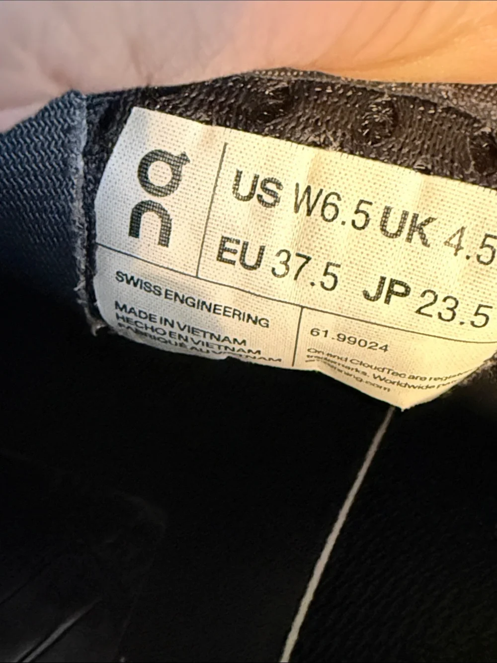 On Running Women’s Black Athletic Sneakers with Gray Sole Accents